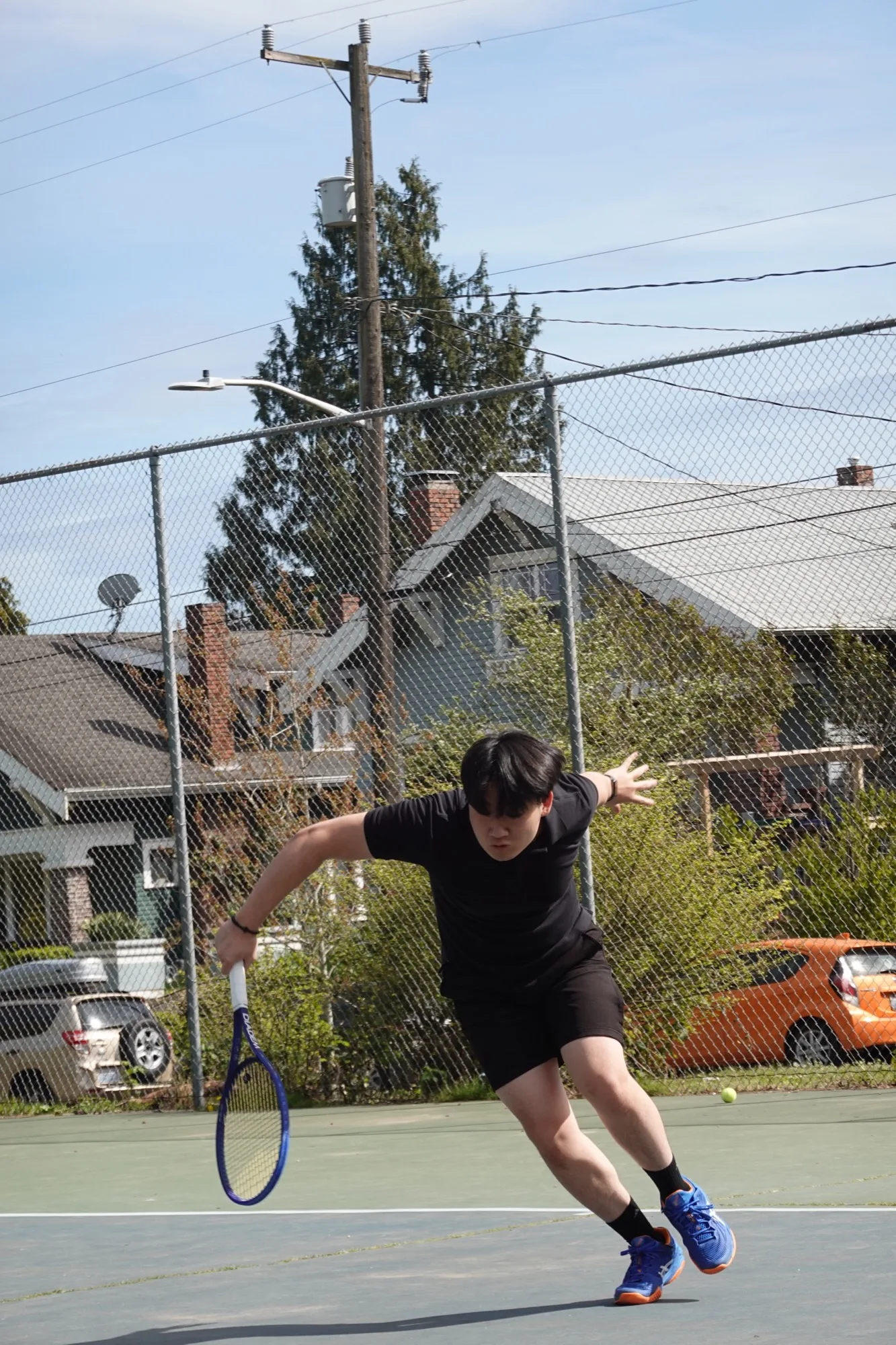Joseph Chamdani slice follow-through with Diadem Elevate 98 racket