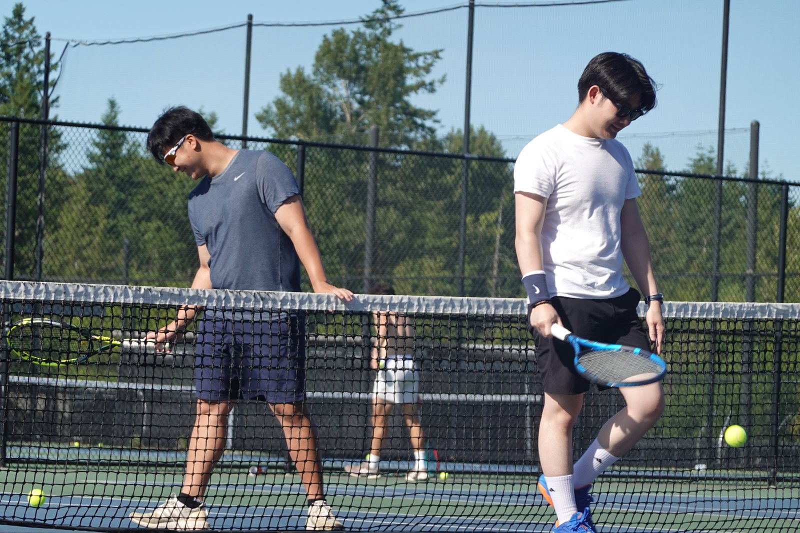 Joseph Chamdani with tennis partner on the court
